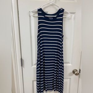 Sleeveless, small navy and white dress.